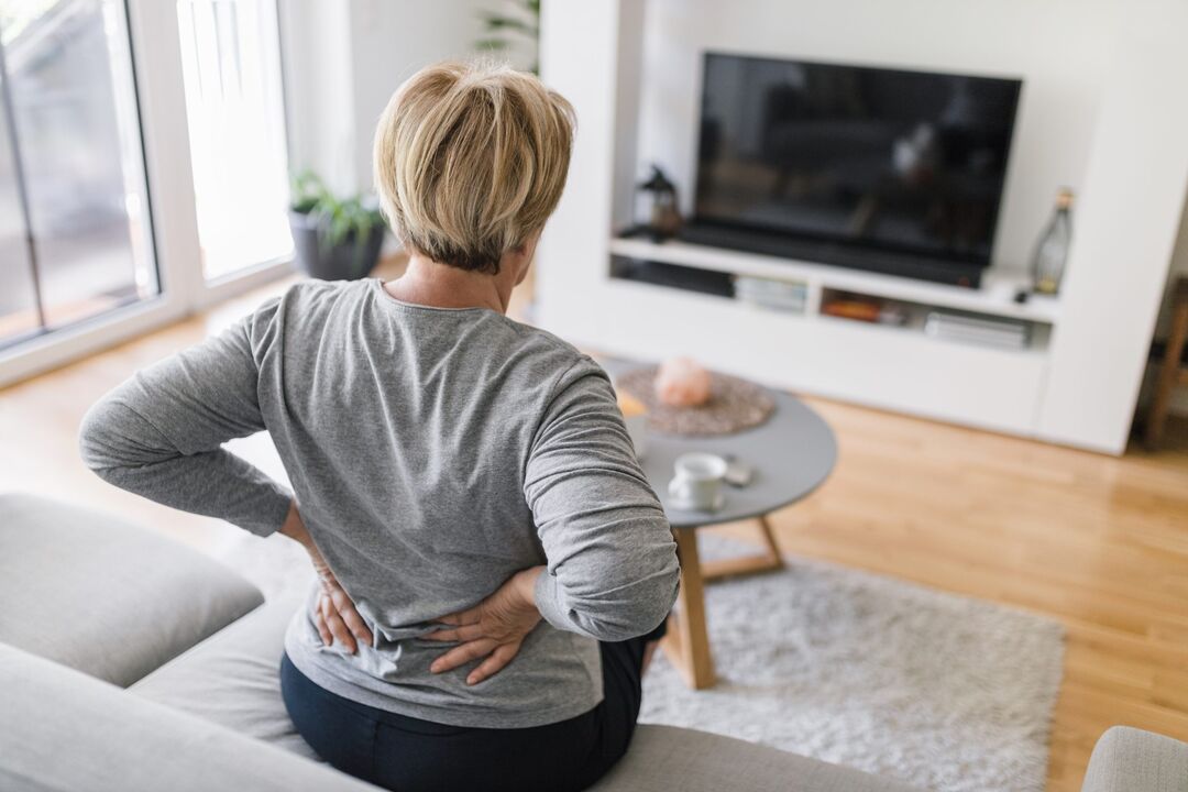 A woman is worried about pain in her lower back